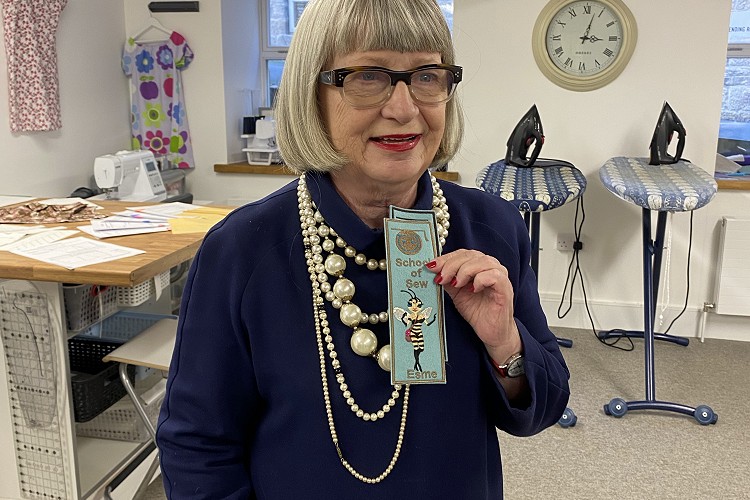 Esme holding up the bookmark we made for her