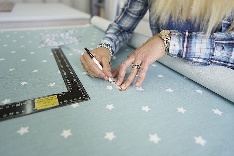 marking fabric on the cutting table